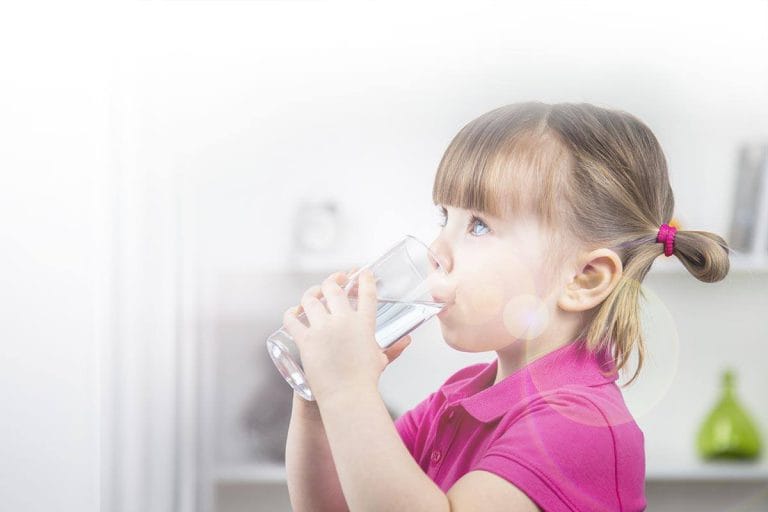 Child-Drinks-Water-From-A-Glass